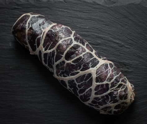 Marinated lamb shoulder wrapped in caul fat
