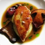 poussin with bolete wine sauce baby spring onion, and gouda semolina