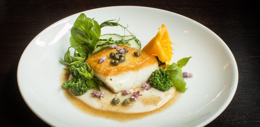 Halibut With White Bean Puree, Chickweed, Milkweed, and Flowers
