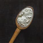 dried or dehydrated puffball mushroom powder on a spoon.