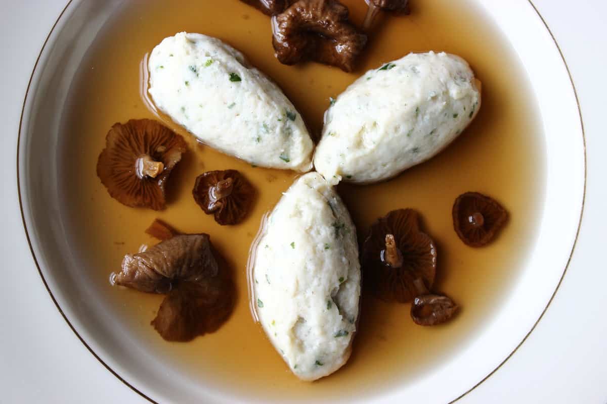 yellowfoot chanterelle consomme with northern pike mousseline dumplings