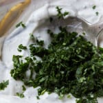 mixing cilantro into yoghurt
