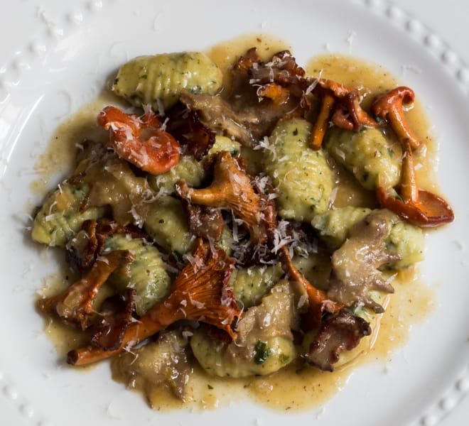 Herb gnocchi with red chanterelles and