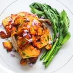 Chicken smothered with chicken of the woods, with milkweed shoots