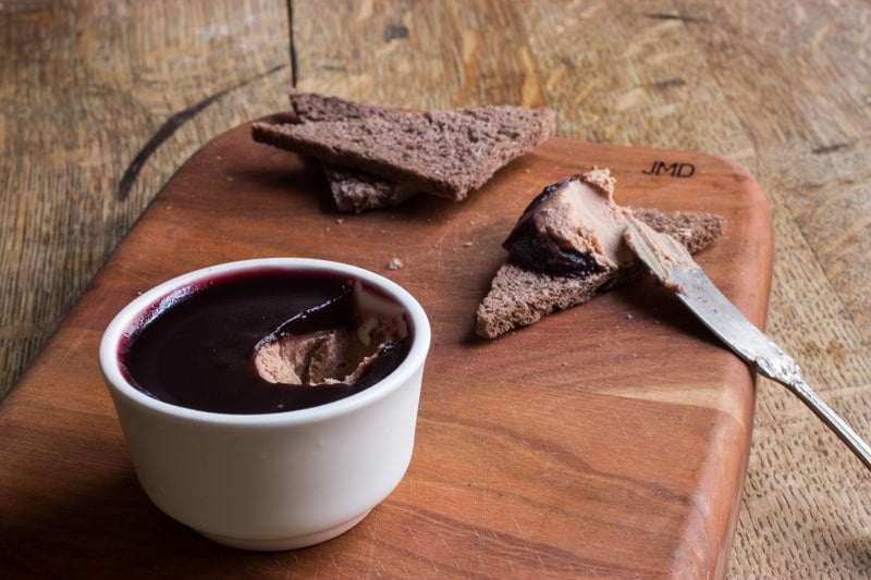 a ramekin of duck liver mousse with jelly 