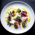 Heirloom tomato salad with ramp oil and pickled chanterelles