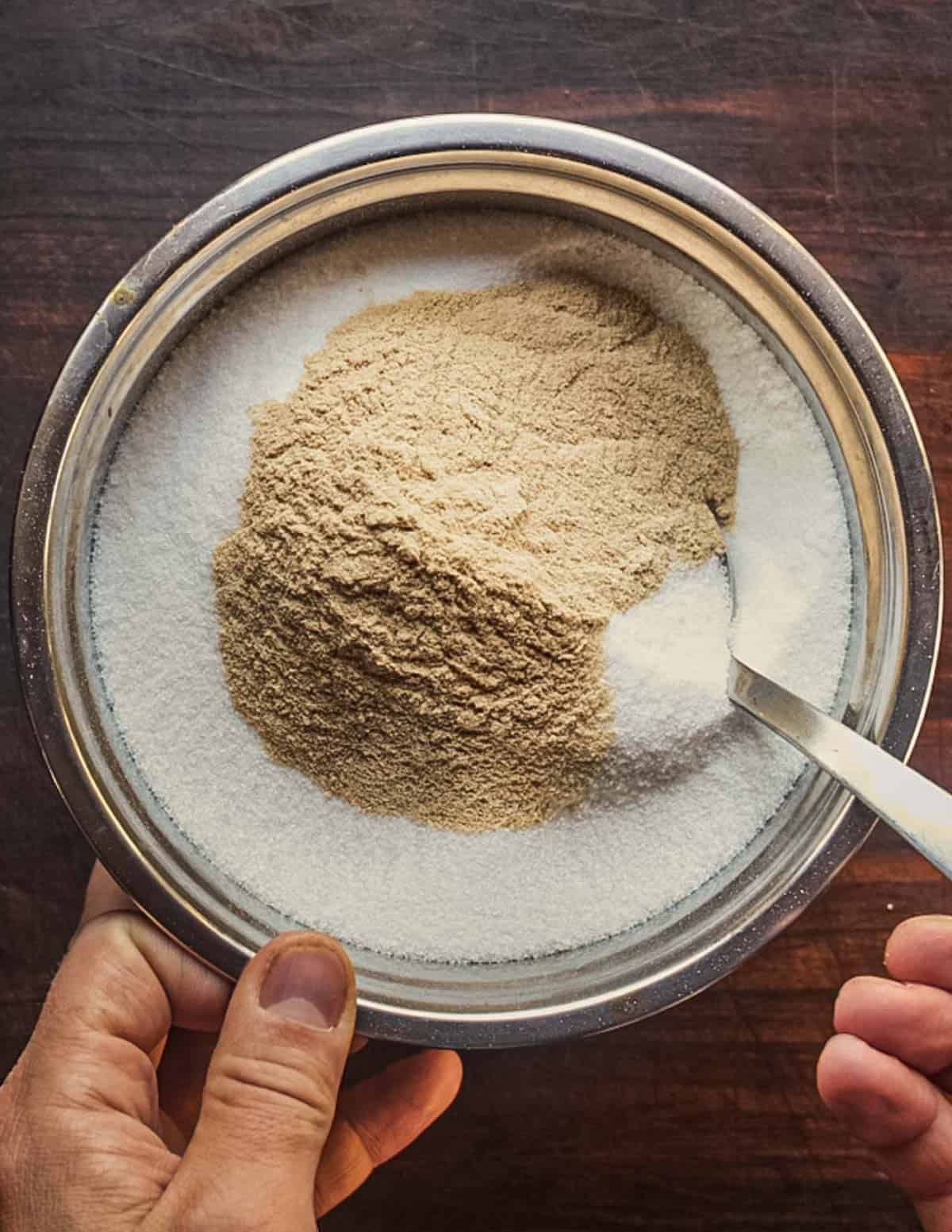Mixing sugar and pectin for jelly making.