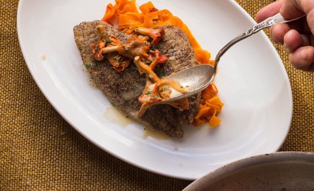 Buckwheat crusted sole with red chanterelle pan sauce and carrot ribbons. carrot ribbon,