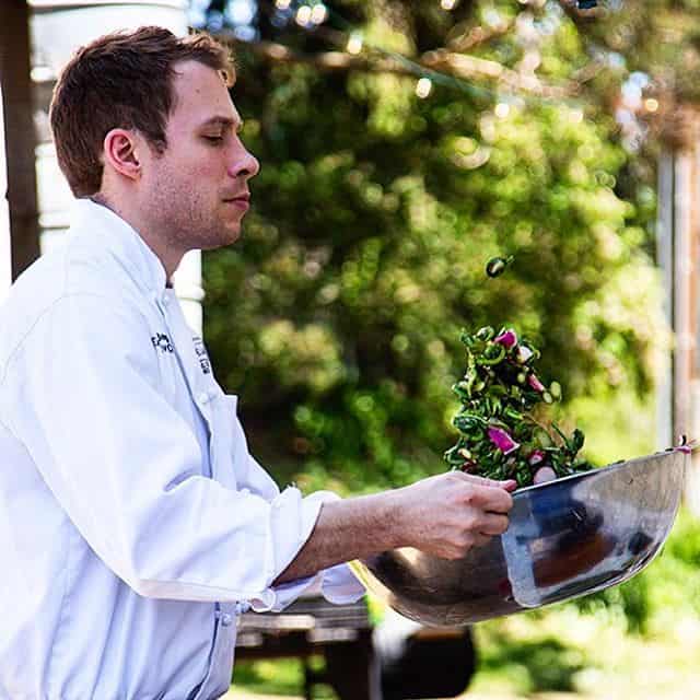 Chef Alan Bergo tossing salad at Piney Hill