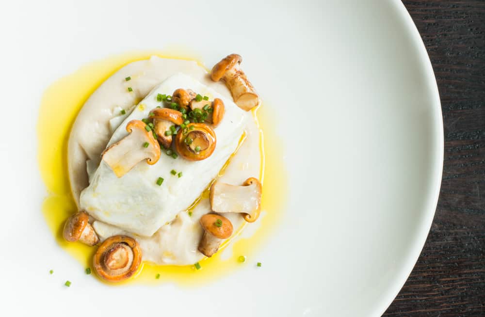 Braised Halibut with White Bean Puree Acorn Oil and Chanterelles