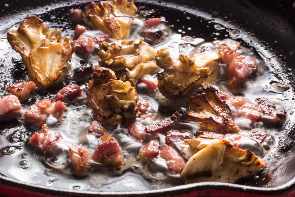 Cooking hen of the woods mushrooms with bacon