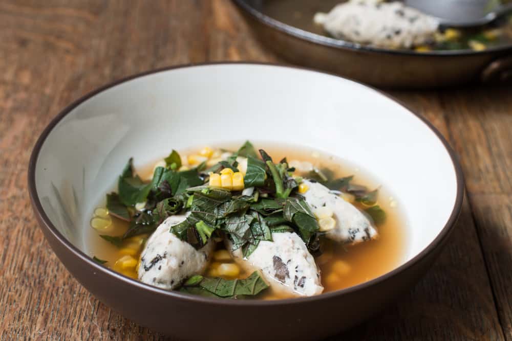 Peacock dumplings with black trumpet mushrooms, sweet corn and amaranth