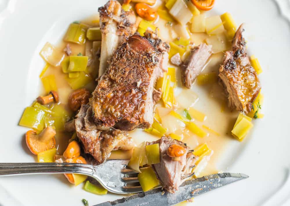 Peacock thigh confit with chanterelles and leeks