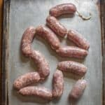 venison Italian sausage on a baking sheet