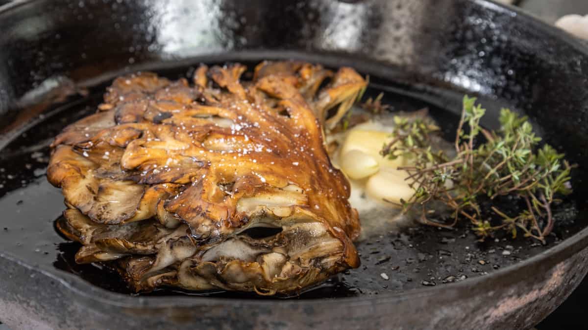 Cooking hen of the woods mushroomsteaks 