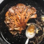 cooking hen of the woods steaks in a cast iron pan