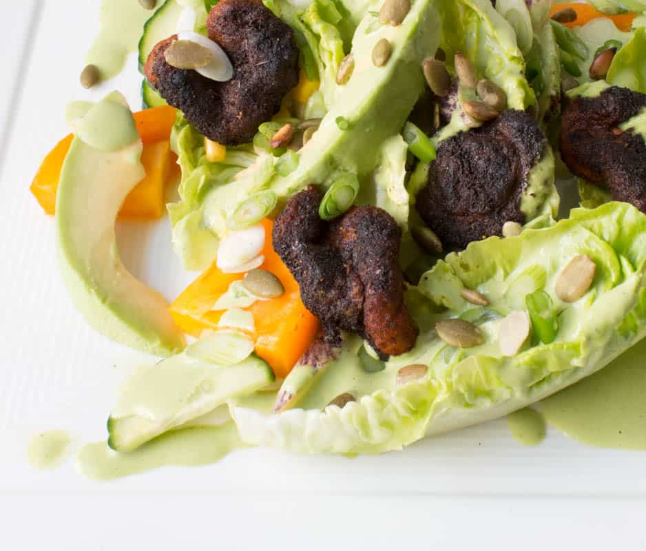 Baby gem lettuce with buttermilk dressing, herbs, pumpkinseeds, tomato, cucumber, and blackened aborted entoloma mushrooms. 