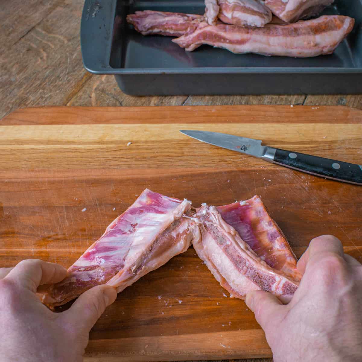 Cutting a lamb breast in half 
