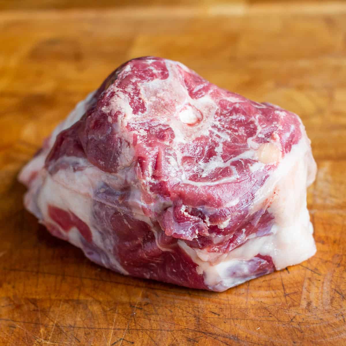 lamb neck on a cutting board 
