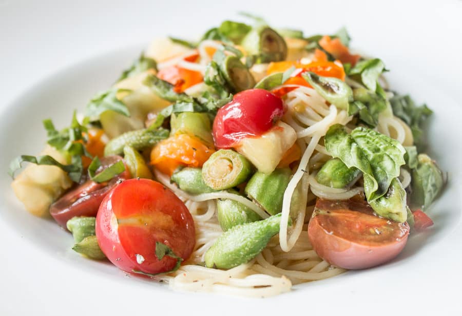 Angel hair pasta with milkweed pods, heirloom tomates and basil