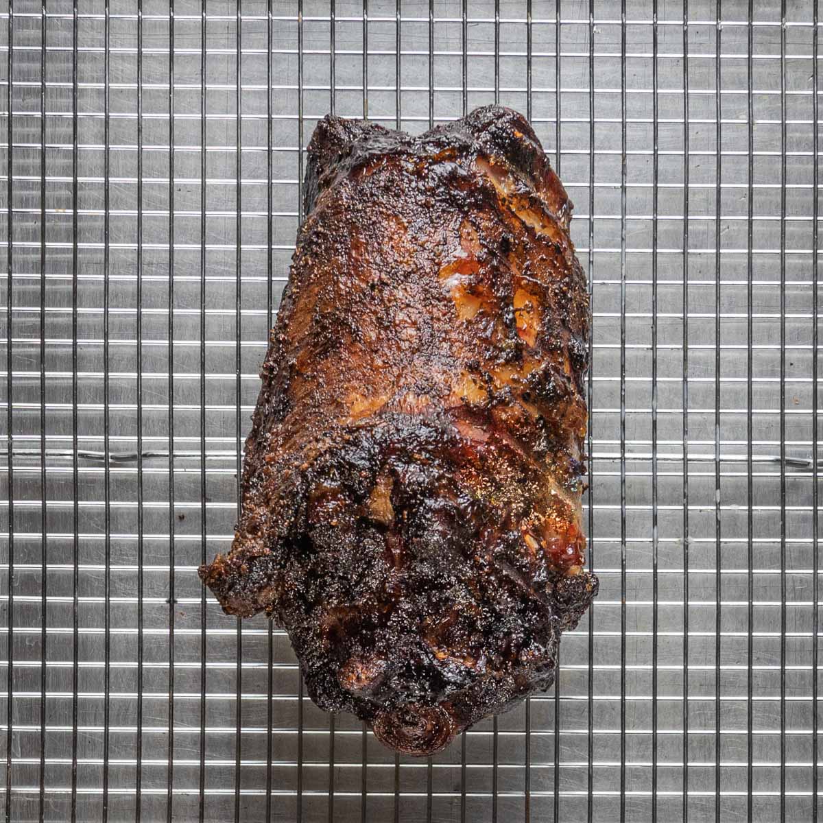 smoked lamb neck on a baking sheet