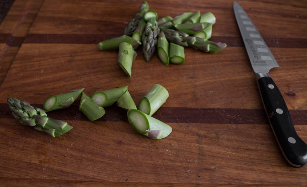 Cutting asparagus on the oblique, or roll cut.