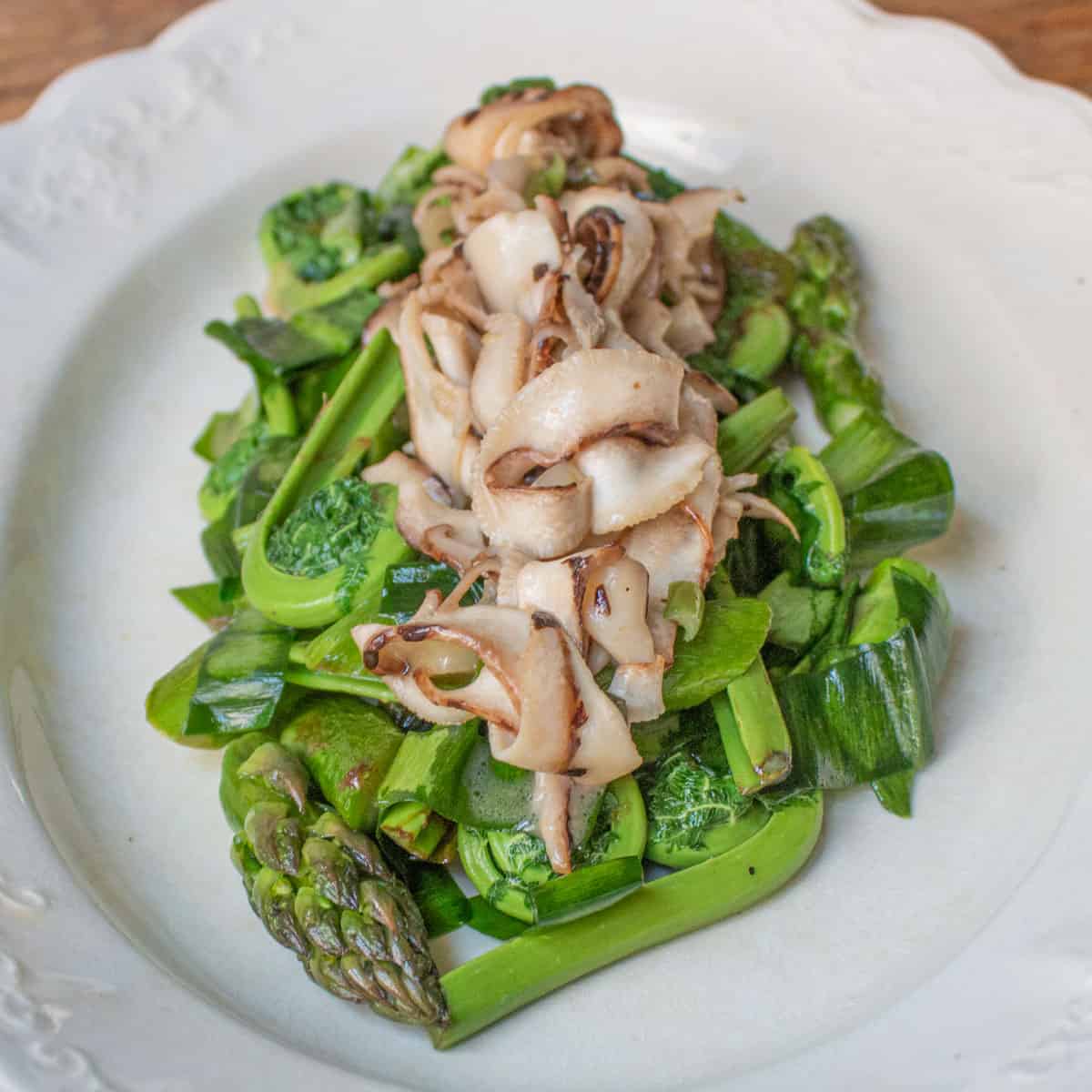 Asparagus and fiddleheads with shaved dryad saddle mushrooms recipe