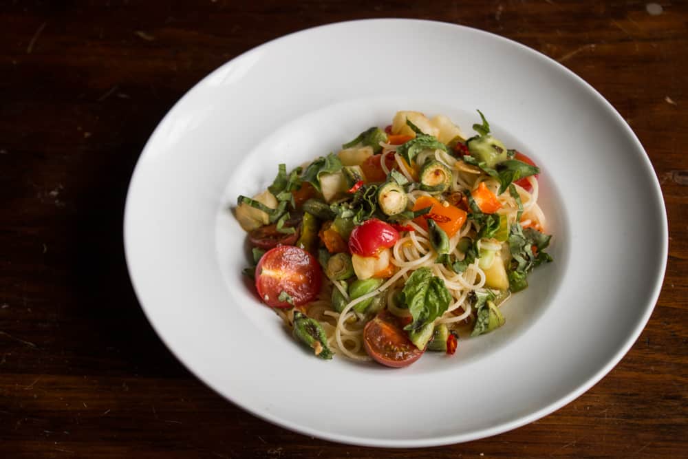 Spaghetti with milkweed pods, heirloom tomatoes and basil