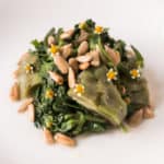 cooked sunflower buds with greens and sunflower seeds