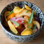Tomato and peach salad with Erechtites hieraciifolius burnweed fireweed