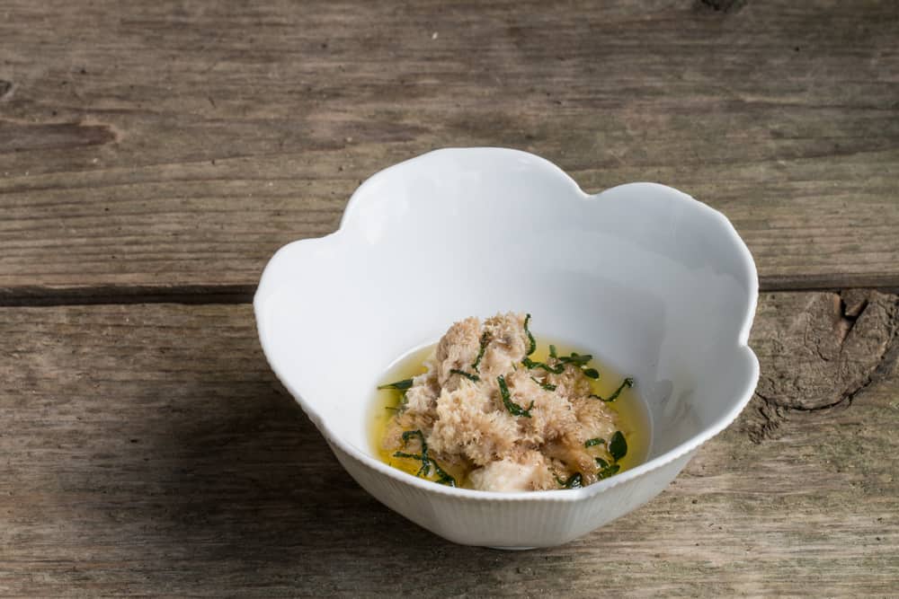 Steamed hericium corralloides mushrooms with drawn butter and fried herbs