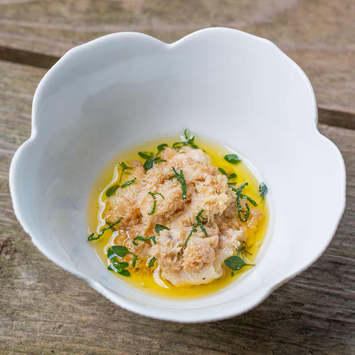 Steamed hericium corralloides mushrooms with drawn butter and fried herbs