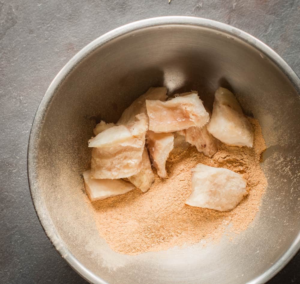 Dredging burbot or lingcod pieces in a lobster mushroom crust