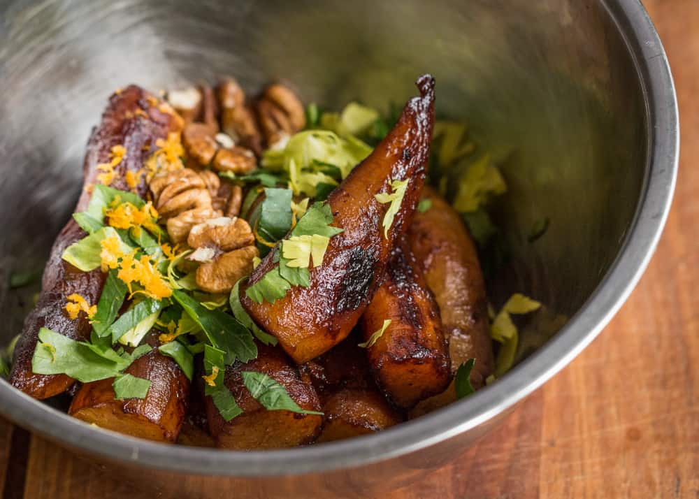 Birch syrup glazed sunchokes with hickory nuts and orange