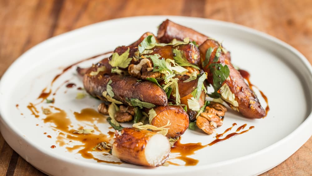 Glazed Sunchokes with Birch Syrup, Hickory Nuts and Orange -image