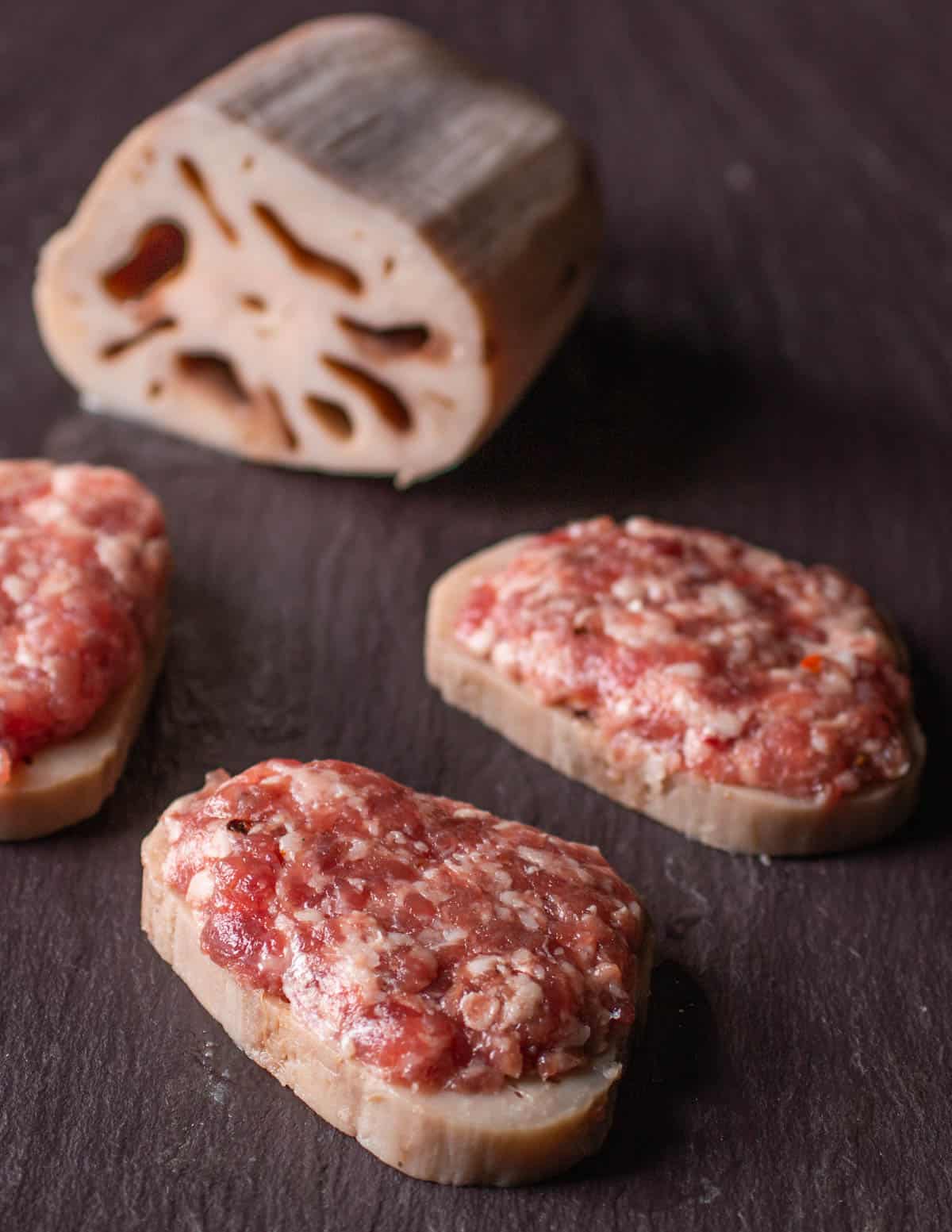 lotus root sliced and stuffed with sausage 