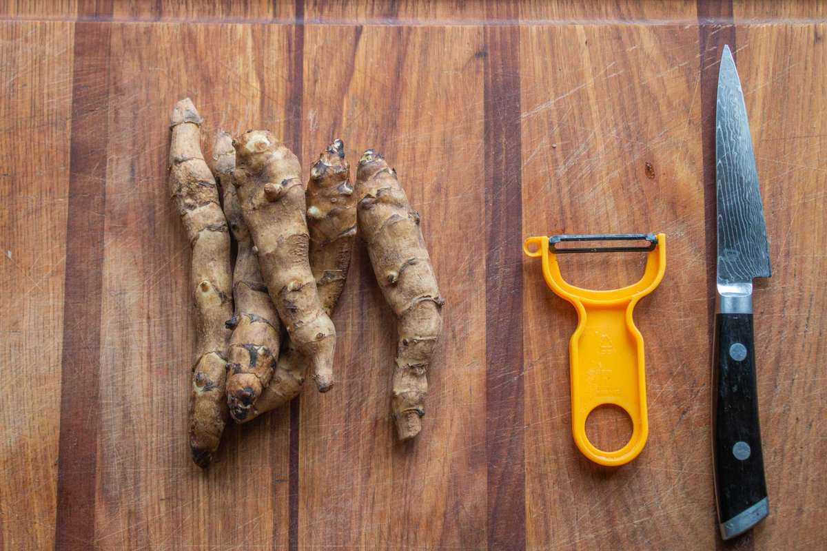 raw sunchokes on a cutting board