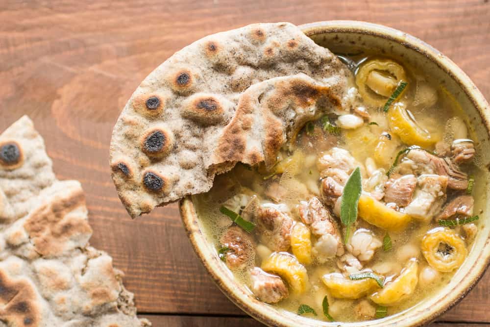 Goat stew with barrel cactus buds, sage, tepary beans, and wood ash hominy