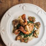 Seared prawns with coral or ramaria mushrooms, heirloom garlic butter sauce and lacinato kale