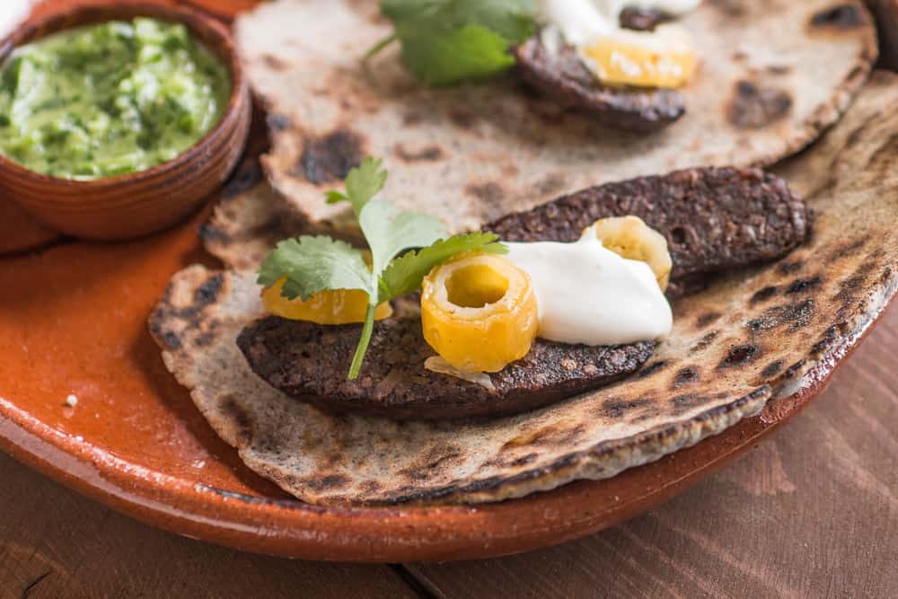 Cactus seed tacos with dried barrel cactus fruit and blood sauage