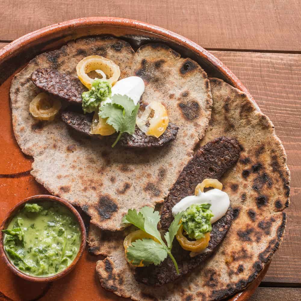 Cactus seed tacos with dried barrel cactus fruit and blood sauage