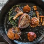 Pigeon with chestnut boletes, spring onions, purslane and salted gooseberries