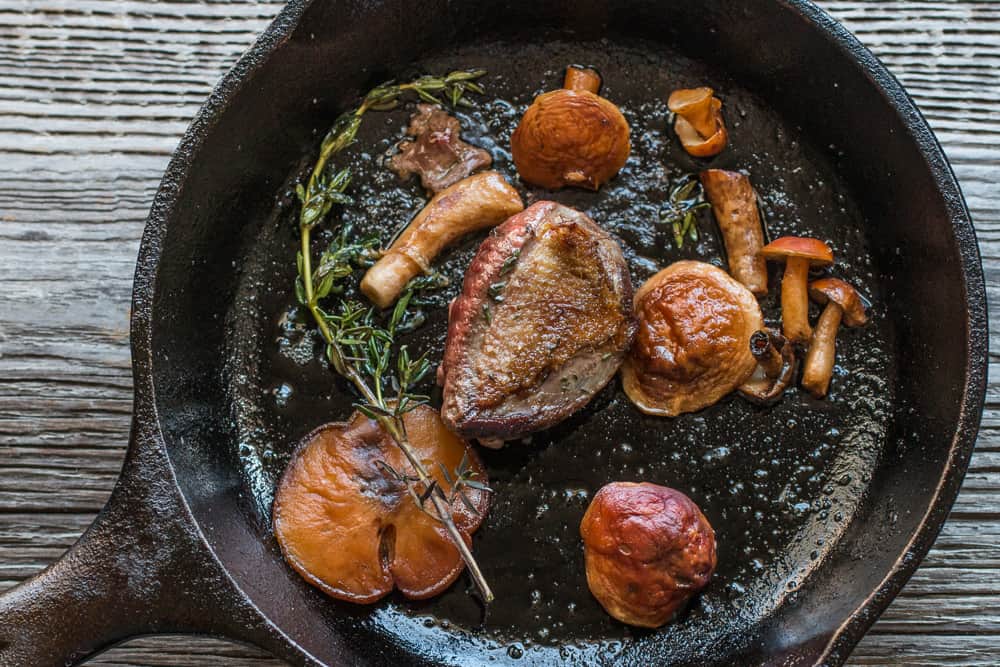 Pigeon with chestnut boletes, spring onions, purslane and salted gooseberries