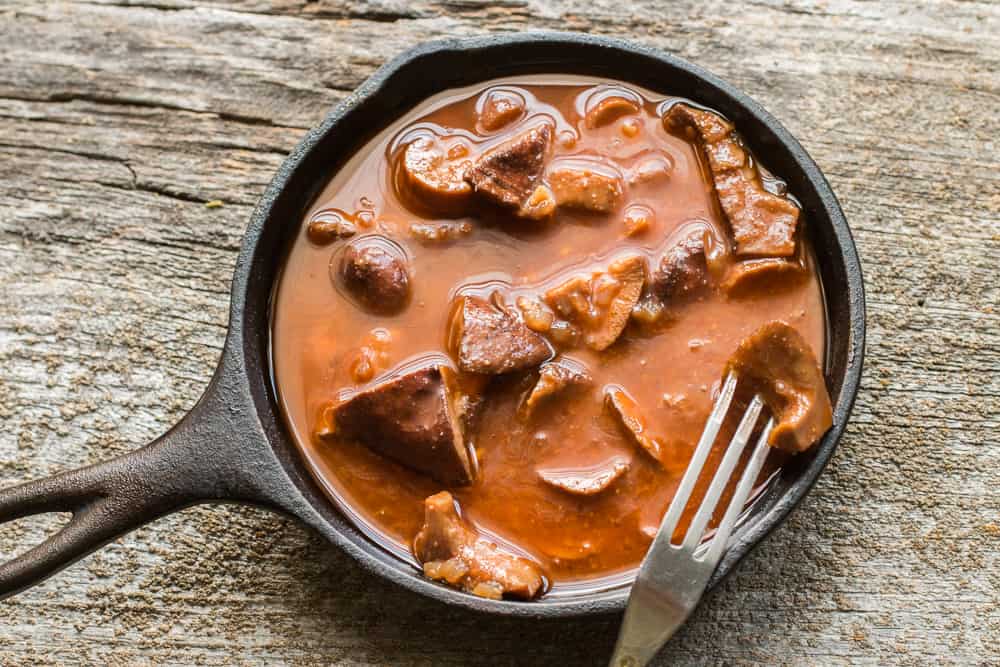 Lactifluus volemus or milk cap mushrooms marinated with tomato, coriander, and lemon