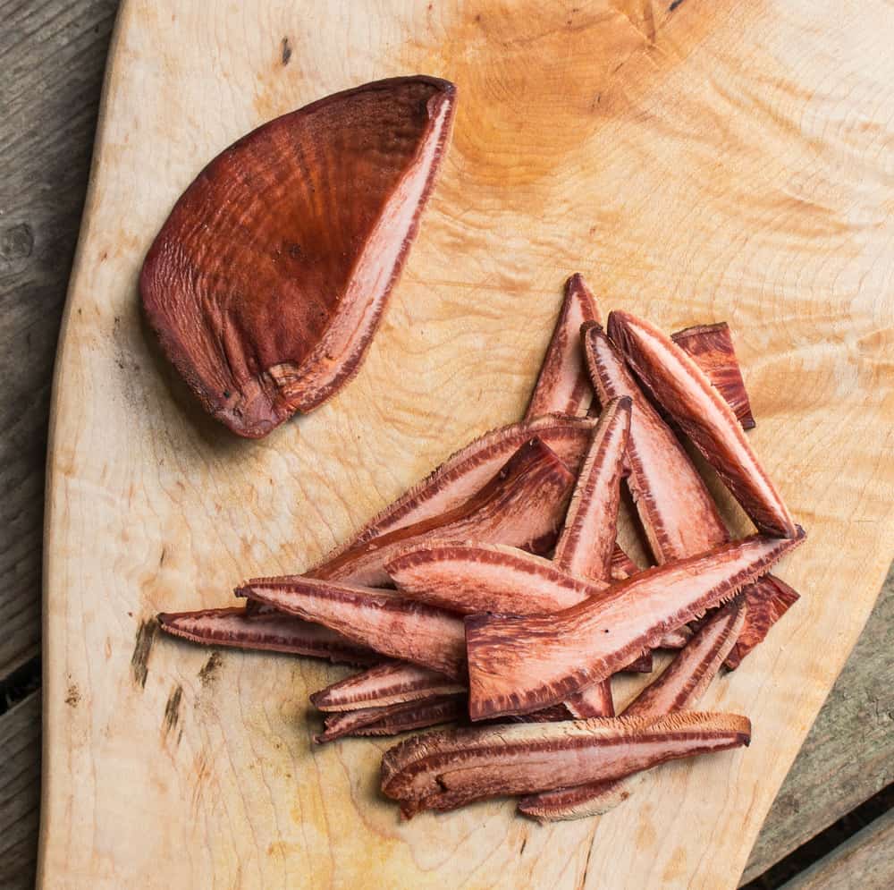 Cutting up beefsteak or Fistulina hepatica mushrooms