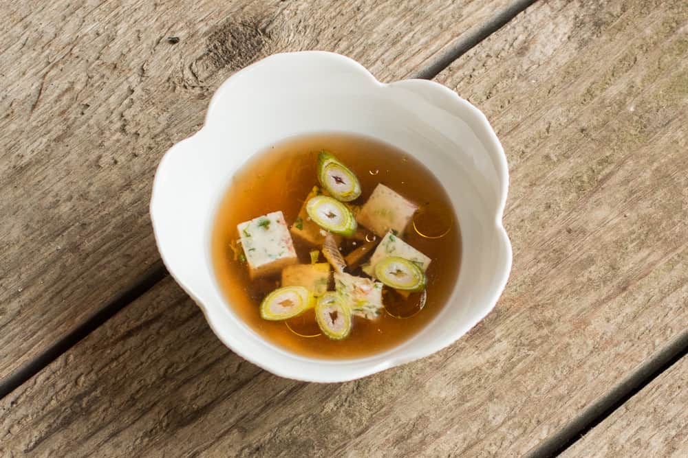 Lactifluus volemus mushroom broth with shrimp mousseline dumplings