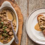 a dish of chicken livers being spooned over toast