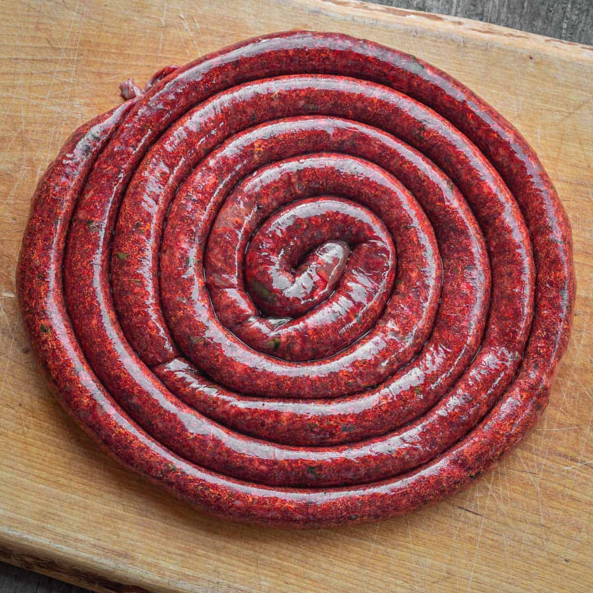 a coil of fresh homemade blood sausage 