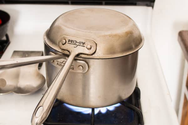 Steaming greens in a pot with a lid 