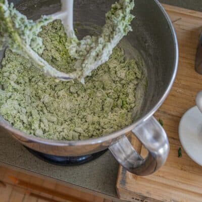 mixing pasta dough in a stand mixer.